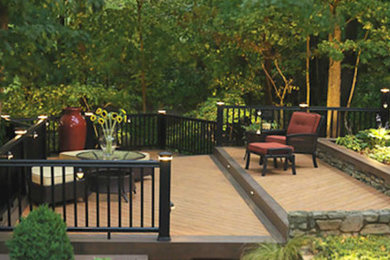 Example of a mid-sized backyard deck design in Philadelphia