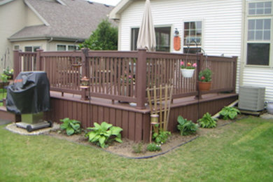 Mid-sized backyard deck photo in Other with no cover