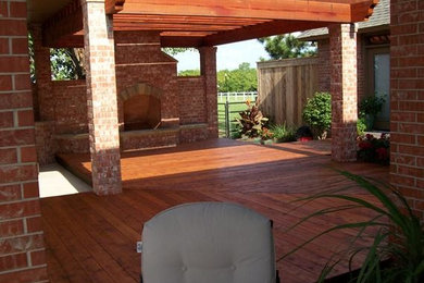 Mid-sized elegant backyard deck photo in Oklahoma City with a fire pit and a pergola