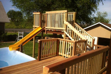 Example of a mid-sized backyard deck design in Seattle