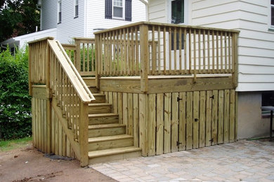 Example of a small backyard deck design in New York with no cover