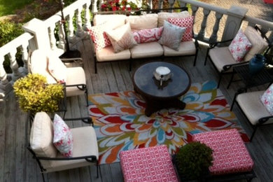 Example of a mid-sized transitional backyard deck design in Philadelphia with no cover