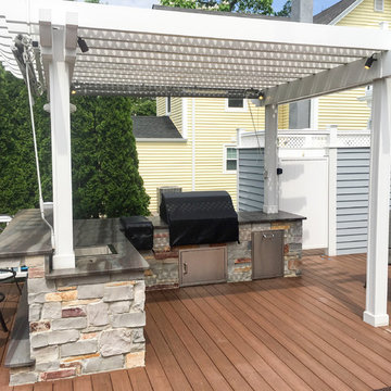 Outdoor deck kitchen with pergola