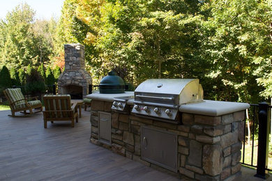 Inspiration for a mid-sized timeless backyard deck remodel in Indianapolis with a fire pit and a pergola