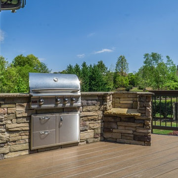 Outdoor kitchen with grill and green egg.