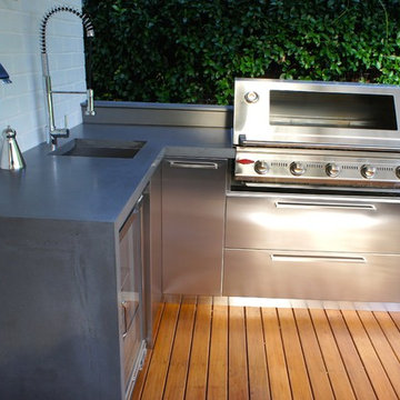 Outdoor Kitchens with Polished Concrete Benchtops & Stainless Steel Doors