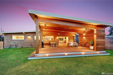 Deck - large modern backyard deck idea in Seattle