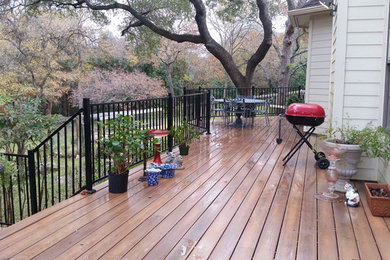 Example of a large classic backyard deck design in Austin