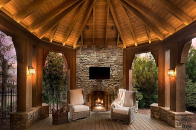 Inspiration for a rustic deck remodel in Atlanta with a fire pit