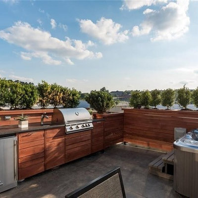 Example of a mid-sized minimalist rooftop outdoor kitchen deck design in Other with no cover