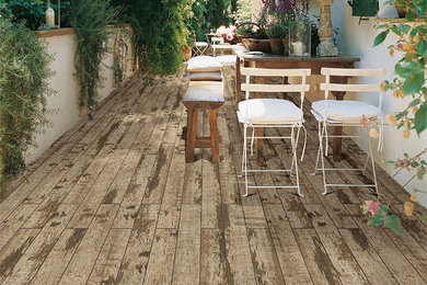 Inspiration for a cottage side yard deck remodel in Other