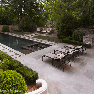 Peachtree battle lap pool with submerged spa and water feature