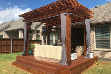 Pergola with cedar deck and prom act curtains
