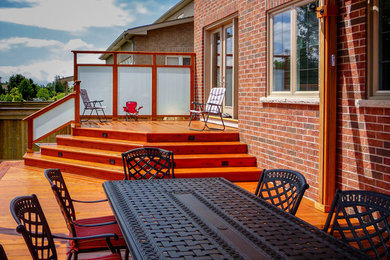 Inspiration for a medium sized traditional back terrace in Toronto with an outdoor kitchen and a pergola.