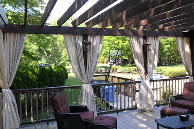 Inspiration for a large classic back terrace in Philadelphia with a pergola.