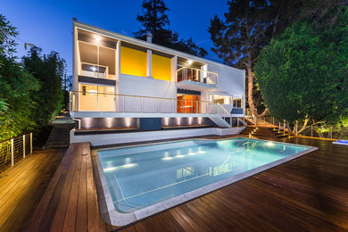 Large mid-century modern backyard deck photo in Los Angeles