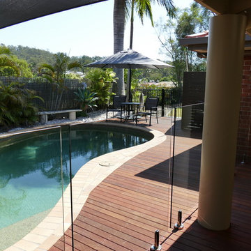 POOL DECK WITH GLASS POOL FENCE