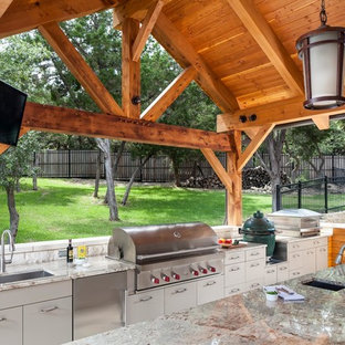 Deck container garden - huge transitional backyard deck container garden idea in Austin with a pergola