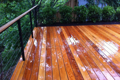 Deck - mid-sized modern backyard deck idea in Austin