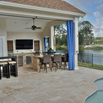 Poolside outdoor kitchen with Evo flat top grill and Big Green Egg