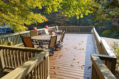 Inspiration for a large timeless backyard deck remodel in Other with no cover