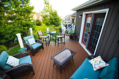 Inspiration for a small modern backyard deck remodel in Toronto with no cover