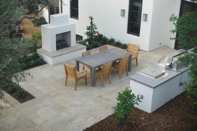 Patio kitchen - mid-sized contemporary backyard patio kitchen idea in Los Angeles with no cover