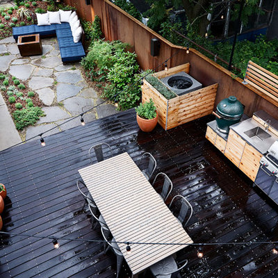 Example of a trendy backyard deck design in New York
