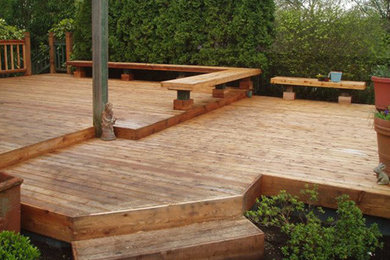 Deck - large backyard deck idea in Seattle with no cover