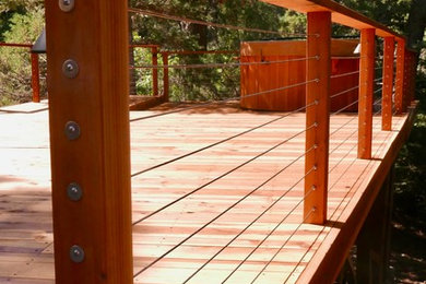Example of a large trendy backyard deck design in Albuquerque