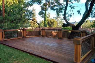 Example of a mid-sized arts and crafts backyard deck design in Los Angeles with no cover