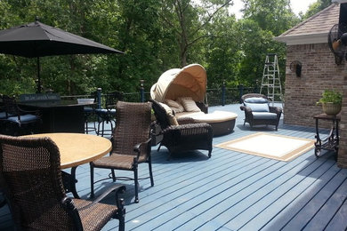 Example of a large classic backyard deck design in Atlanta with no cover