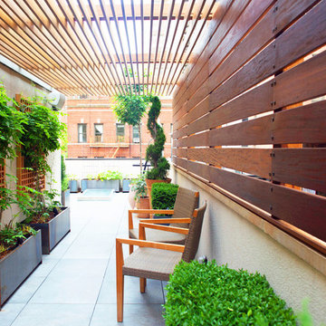 Rooftop Garden with Pergola and Fencing for Outdoor Seating Area
