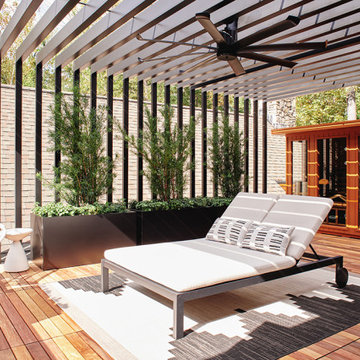 Rooftop Spa Deck with sun filtering through metal pergola
