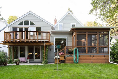 Inspiration for a mid-sized transitional backyard deck remodel in Other with a roof extension