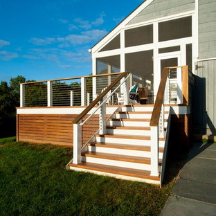 Deck skirting - large transitional backyard deck skirting idea in DC Metro with no cover