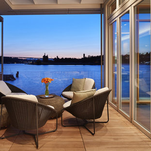 Example of a mid-sized trendy rooftop rooftop deck design in Seattle with a roof extension