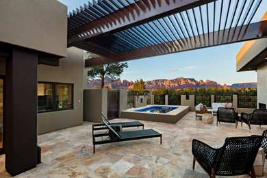 Inspiration for a southwestern deck remodel in Phoenix with a pergola