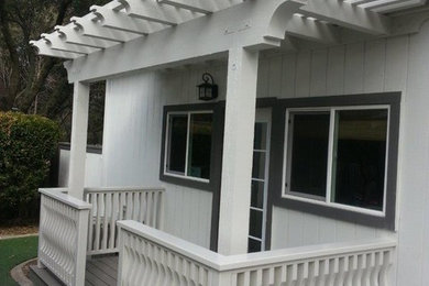 Example of a small classic backyard deck design in Sacramento with an awning