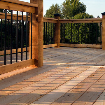 Smith - Cedar deck in Kansas City with stamped concrete patio.