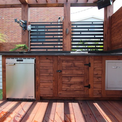 Mid-sized minimalist rooftop outdoor kitchen deck photo in Chicago with a pergola