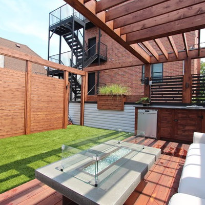 Mid-sized minimalist rooftop outdoor kitchen deck photo in Chicago with a pergola
