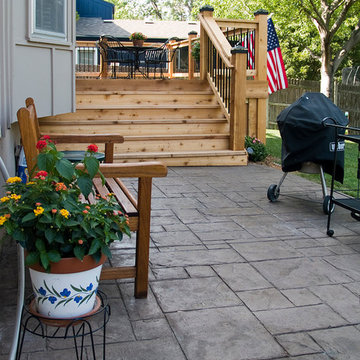 Stoerman - Cedar deck in Overland Park, Ks.  Stamped concrete patio & deck light