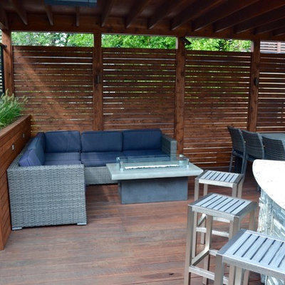 Example of a mid-sized minimalist rooftop outdoor kitchen deck design in Chicago with an awning