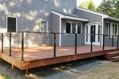 Deck - large contemporary backyard deck idea in Boston with no cover