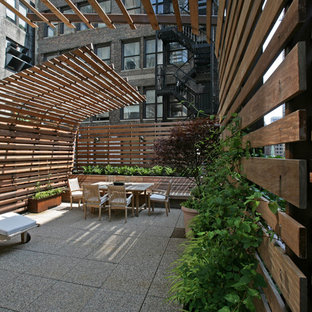 Esempio di una grande terrazza minimalista sul tetto