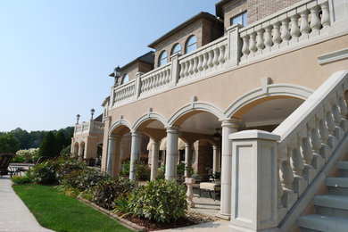 This is an example of a large mediterranean back terrace in Chicago with no cover.