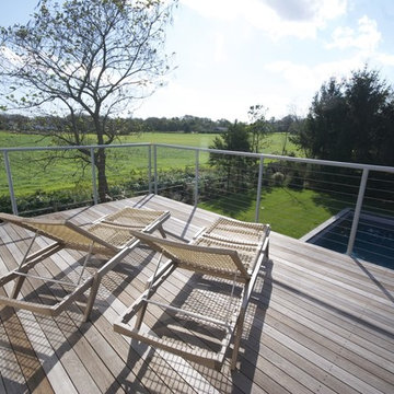 The 2nd floor deck offers views of the neighboring farm field.