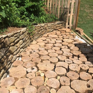 Small eclectic side yard deck photo in Other with no cover