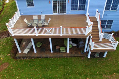 Mid-sized elegant backyard deck photo in New York